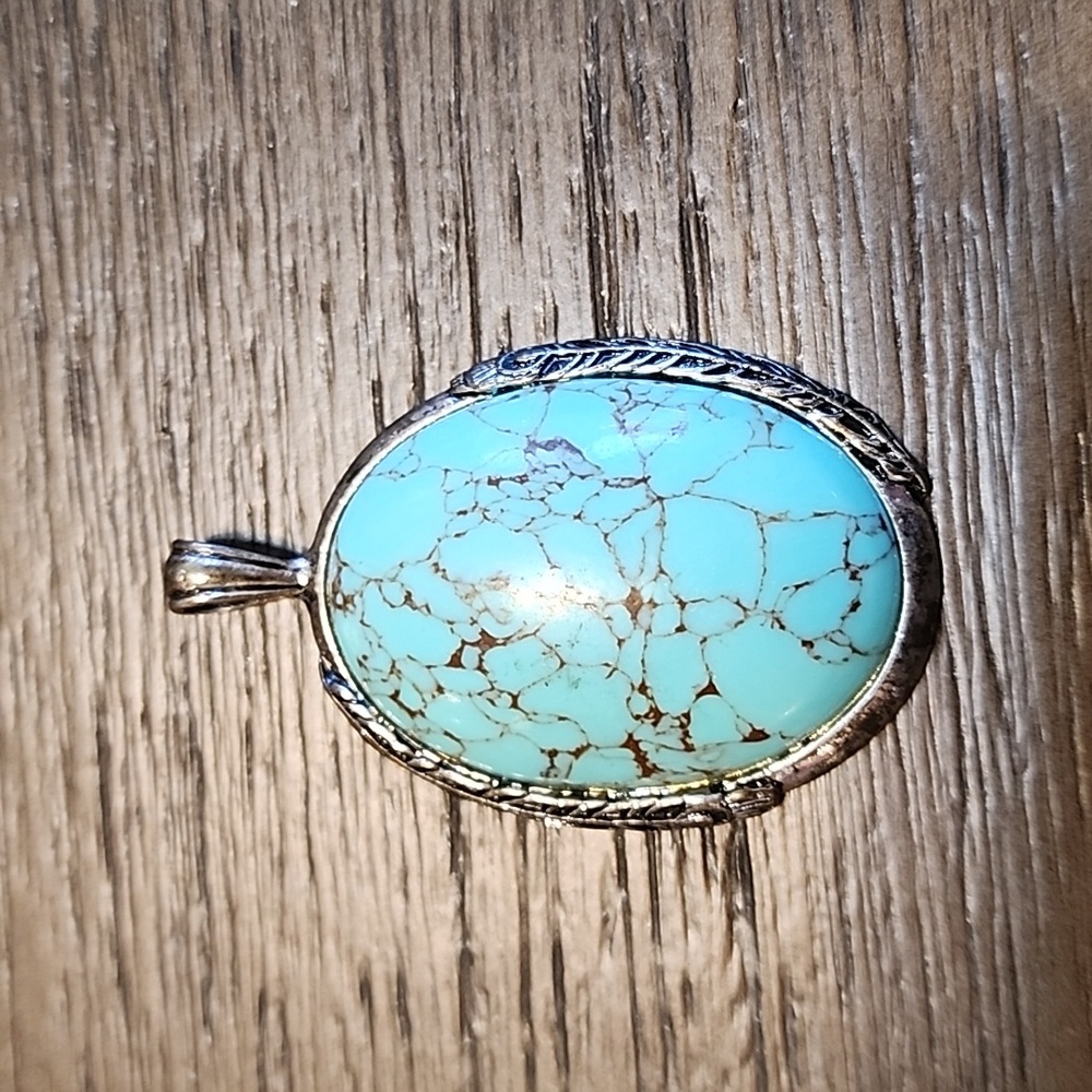 Turquoise charm feather detail back